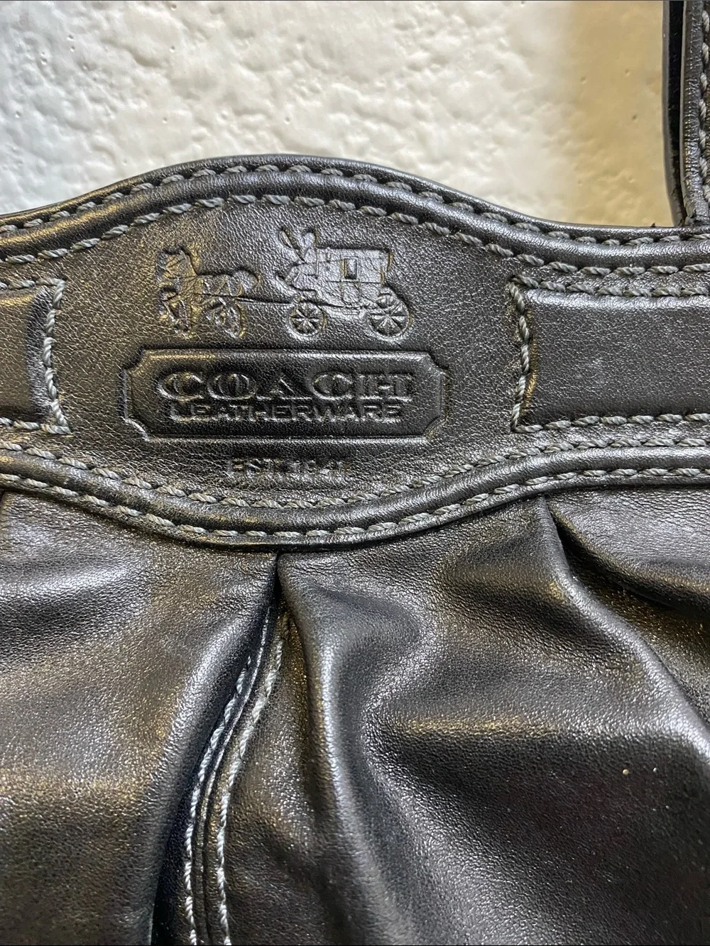 Coach Garnet F13914 pleated shoulder bag with a silver turn lock closure.